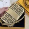 Iconic, boxy mini Baguette bag from the Versace by Fendi collection. Made of gold-coloured leather with FF motif gold laser-cut perforations that create an effect that evokes the Versace metal mesh.