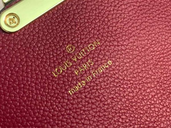 LV wallet in burgundy and Hermes wallet in tan brown